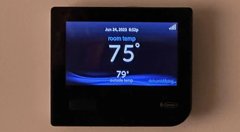 Mechanical Extremes HVAC technician operating dehumidification equipment in a Michigan home